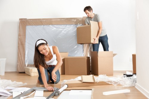 Furniture pick-up service removing a large sofa in Wallington