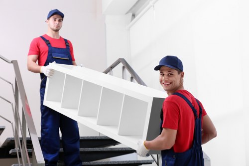 Local removals team handling furniture loading during a Wallington house move