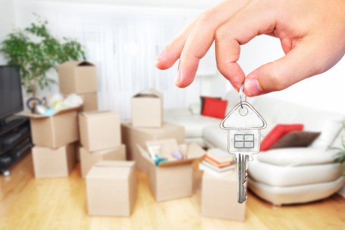 Careful loading of household items into a moving van in Wallington