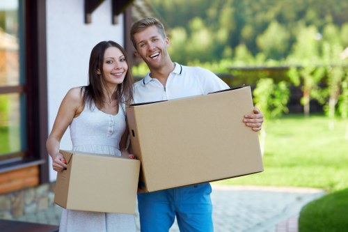 Packed moving boxes and furniture ready for transport in Wallington
