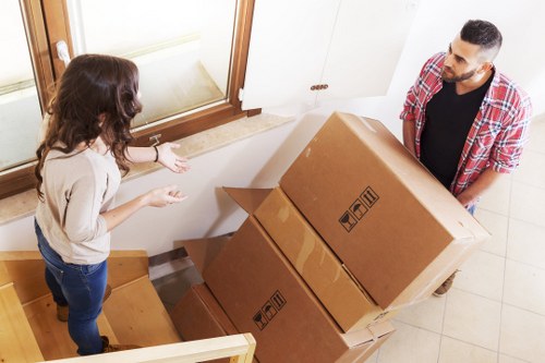 Professional movers protecting furniture during transport in Wallington