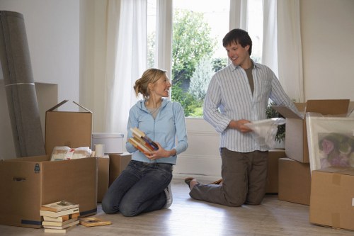 Experienced movers carrying a piano through a Wallington property