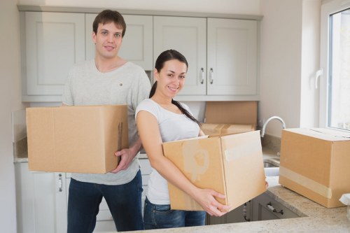 Packing boxes and furniture prepared for flat removals in Wallington